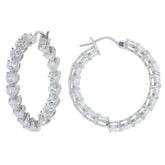 Elegant white Moissanite sterling silver earrings showcasing sparkling gemstones in an exquisite hoop design.